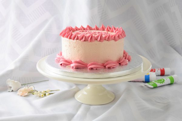 Raspberry buttercream coated cake 3" in height