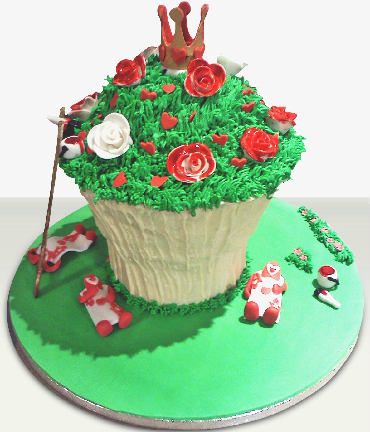 white roses painted red alice themed cake